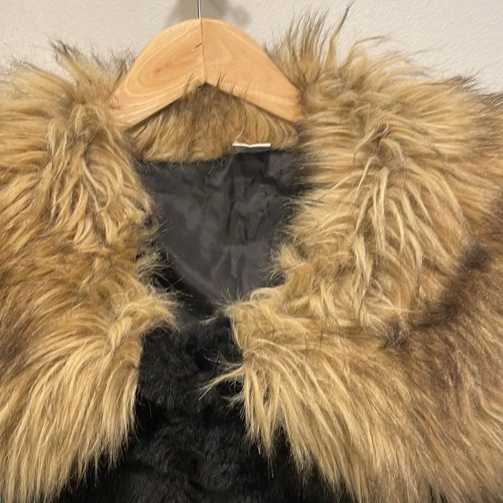 KAPOK Woman’s Black Faux Fur Coat With Faux Brown And Tan Trim Around The Neck